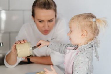 A mother and daughter bonding over baking, enjoying time in the kitchen.